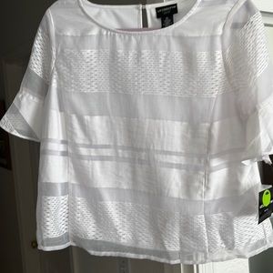 This is a Liz Claiborne career petite, made of 77%r rayon and 23%. Nylon